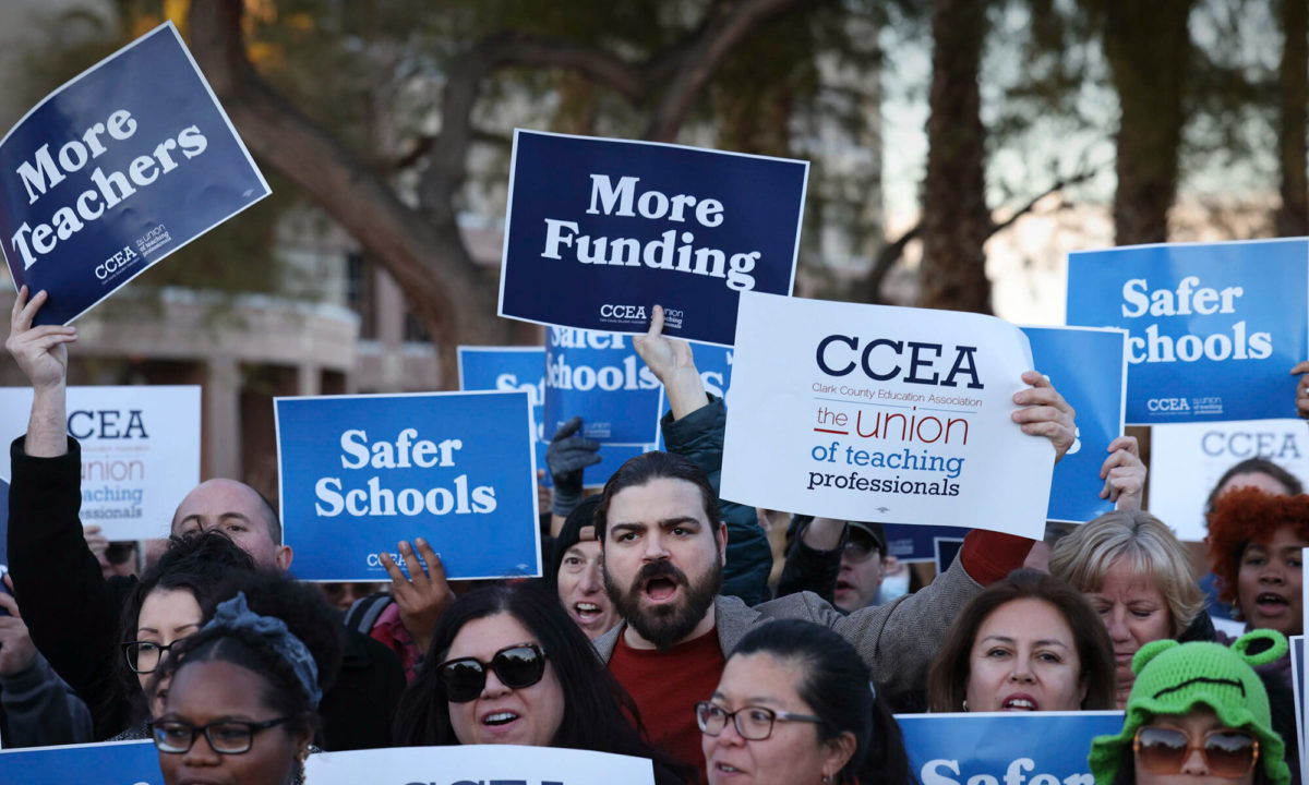 Members of the Clark County Education Association rally in front of the Grant Sawyer State Office Building on Monday, Feb. 6, 2023.